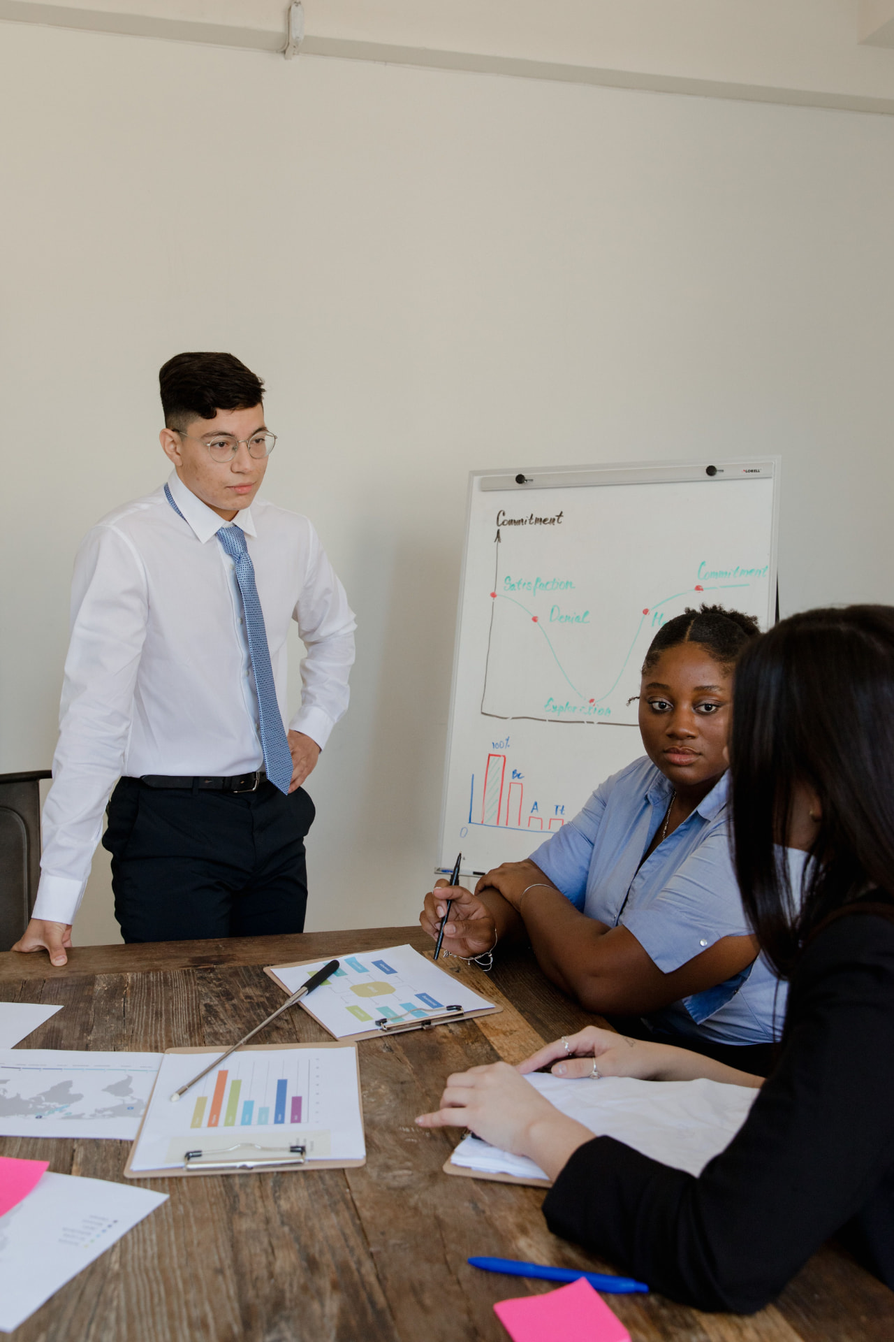 Instructor leading a live, hands-on AI workshop with learners around a table