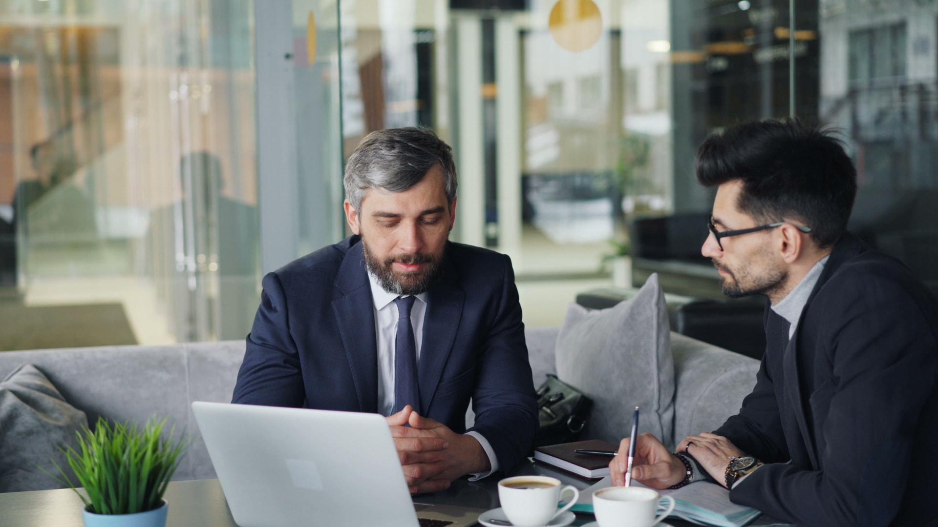 Executive mentorship session between two professionals reviewing an AI roadmap