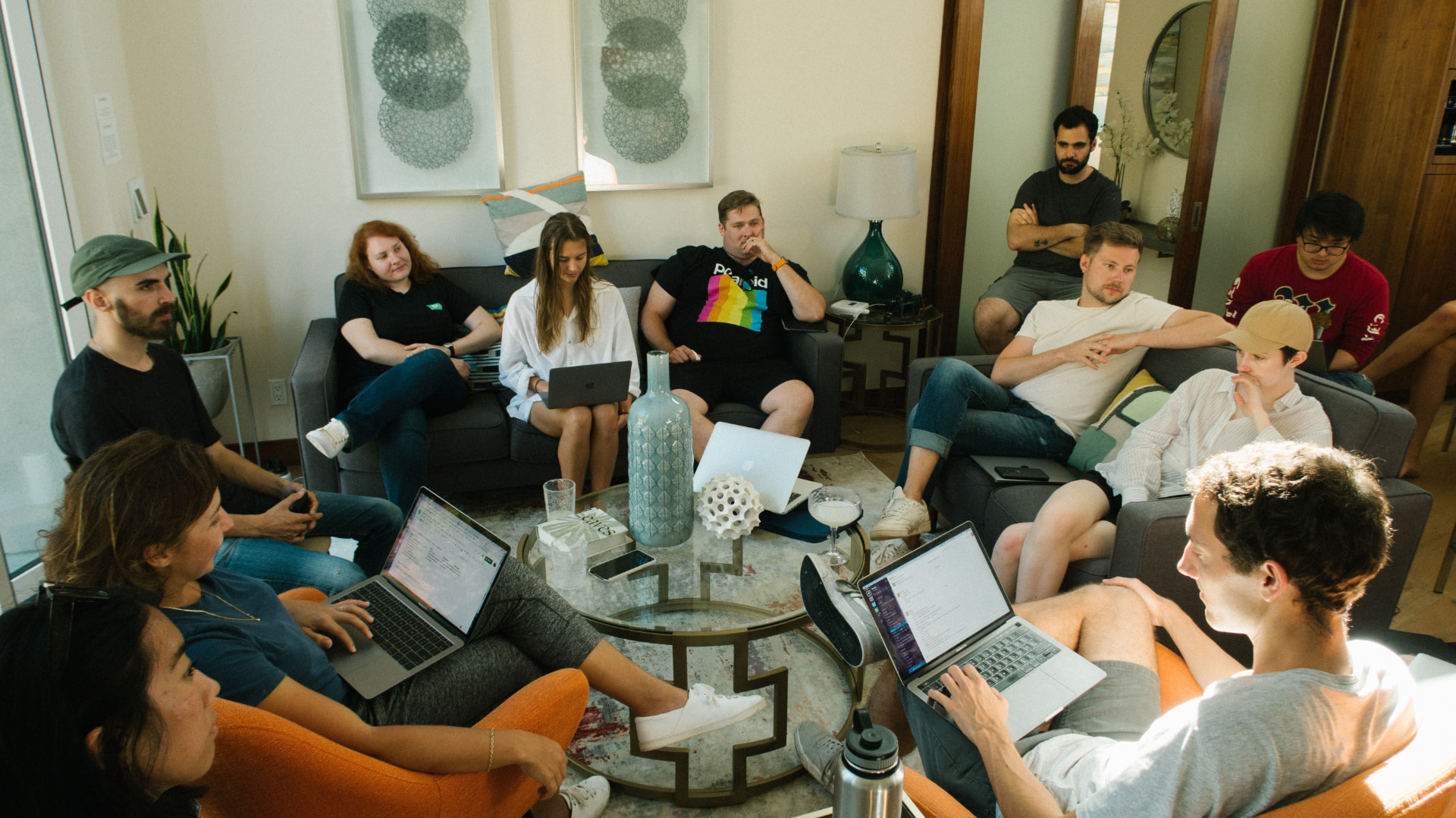 Technical cohort of engineers building AI projects on laptops together